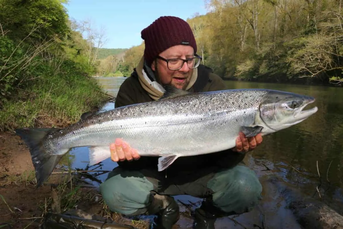 martin bowler with a really big river salmon