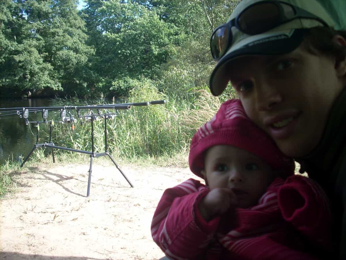 an angler fishing on a river with his little daughter
