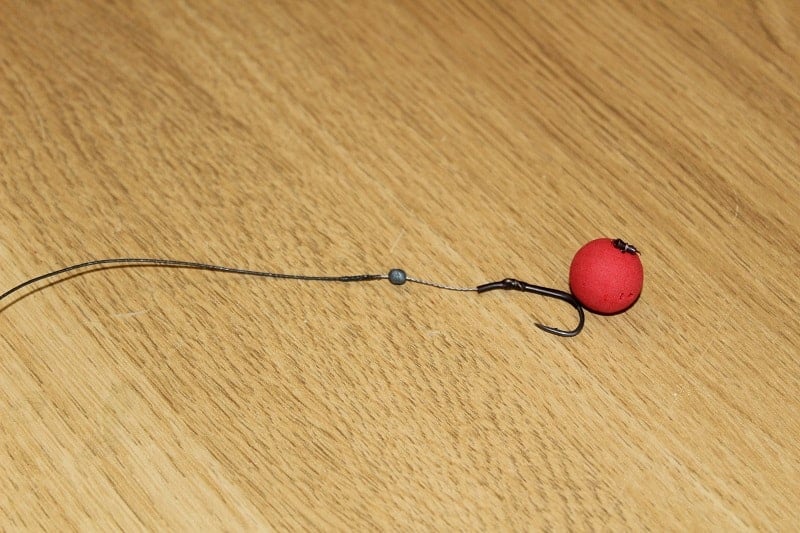 putting a small split shot on a pop-up rig to critically balance the hookbait