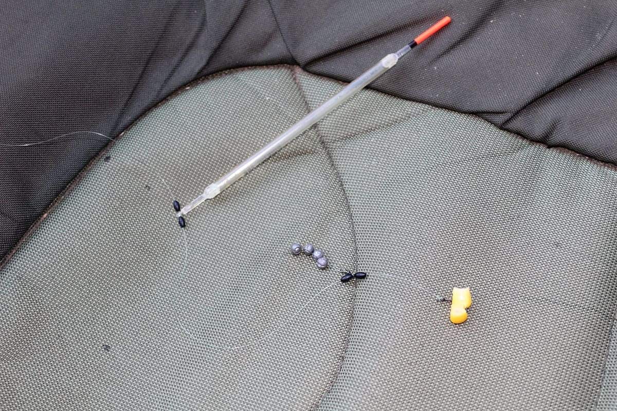 a setup lift method rig including a tench float with float stops, an anchor weight and a pair of sweetcorn on a size 12 wide gap hook