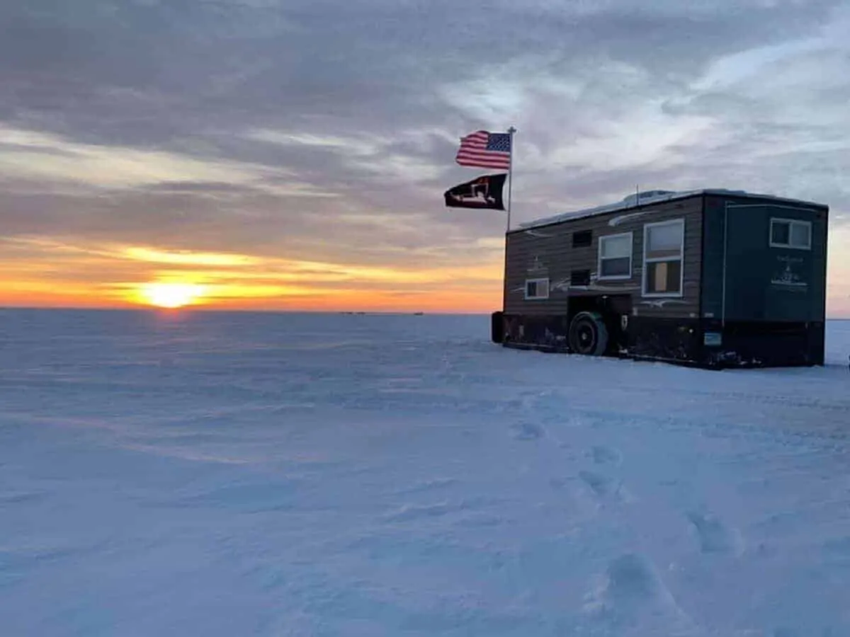 a picture of an ice fishing shack on a frozen Minnesota lake