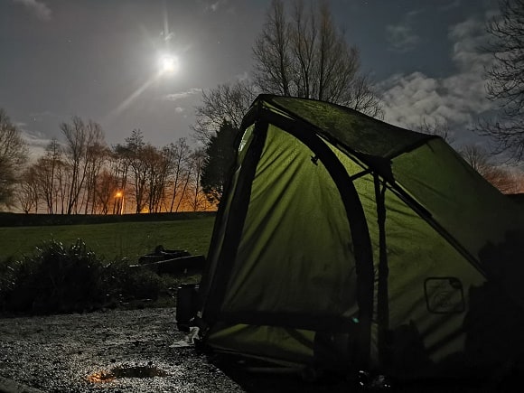 an image of a carp bivvy in the moonlight