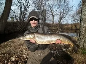 Max Loesche, from Strike and Catch, holding a big pike in this sidebar image.