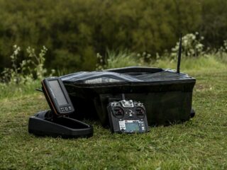 a bait boat for carp fishing with a remote and a fish finder