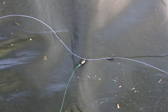 a feeder link on a micro swivel that is trapped on the mainline between two line stops