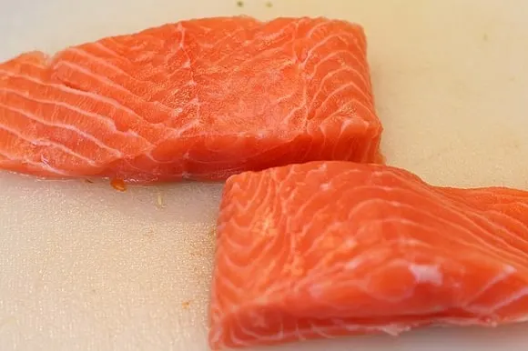 an image of two fresh and red salmon fillets