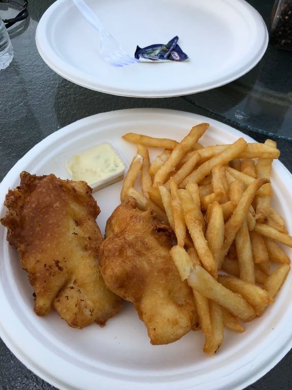 an image of two fired yellow perch fillets with french fries and