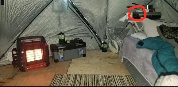 a permanent ice shack with a bed and a co2 detector for the mr buddy heater