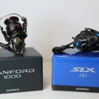 an image of two new shimano reels on a white table