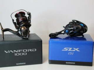 an image of two new shimano reels on a white table