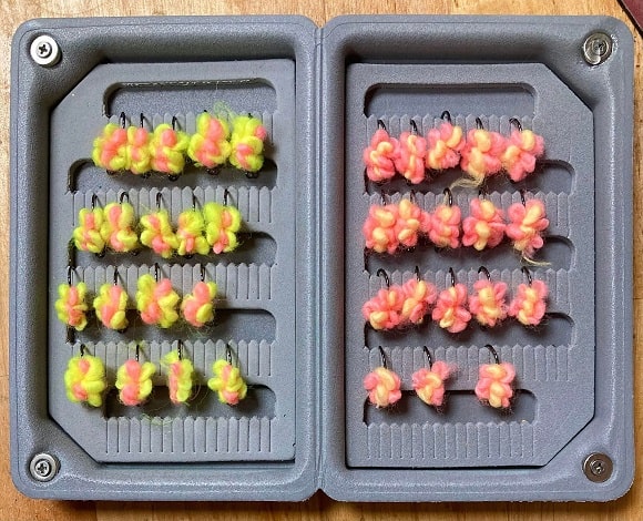 an image of a fly box filled with scrambled egg fly patterns for steelhead