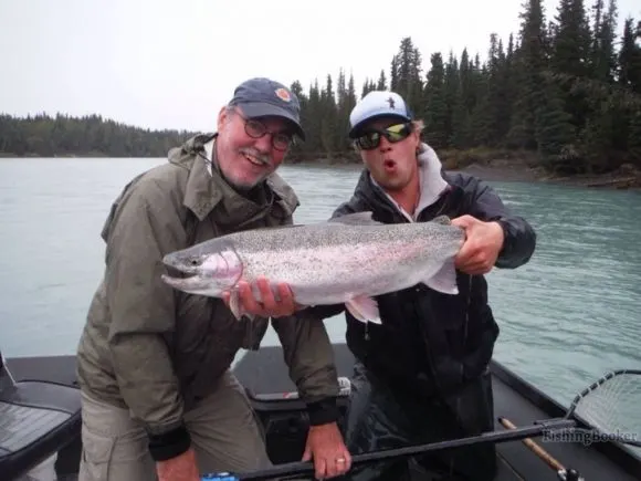 two happy fishers with a big Kodiak steelhead 
