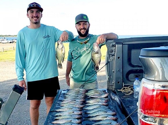 two happy anglers with a bunch of Texas crappie