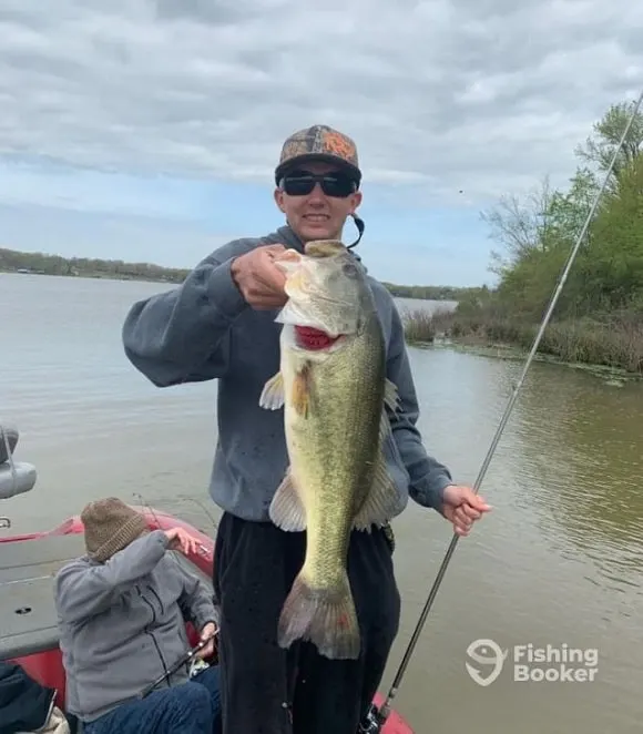 a Texas bass fishing guide holding a big largemouth