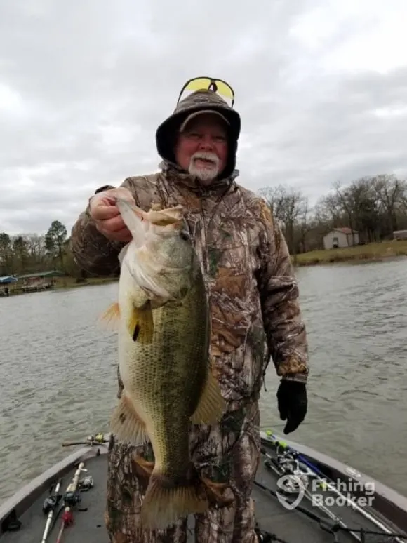 a bass angler on Lake Fork with a huge largemouth bass