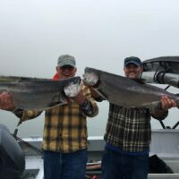 a pair of salmon anglers catching big chinooks on Puget Sound