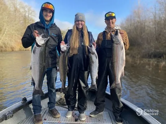 a group of clients fishing with a salmon charter on the Columbia River