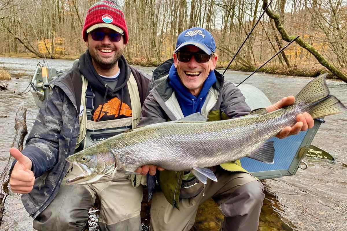 Shane Muckey with a big salmon river steelhead