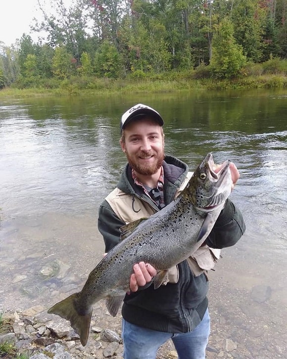 an angler on St. Mary's River with a nice summer Atlantic salmon