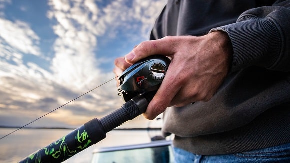 a bass angler on a boat fishing with a Piscifun baitcaster