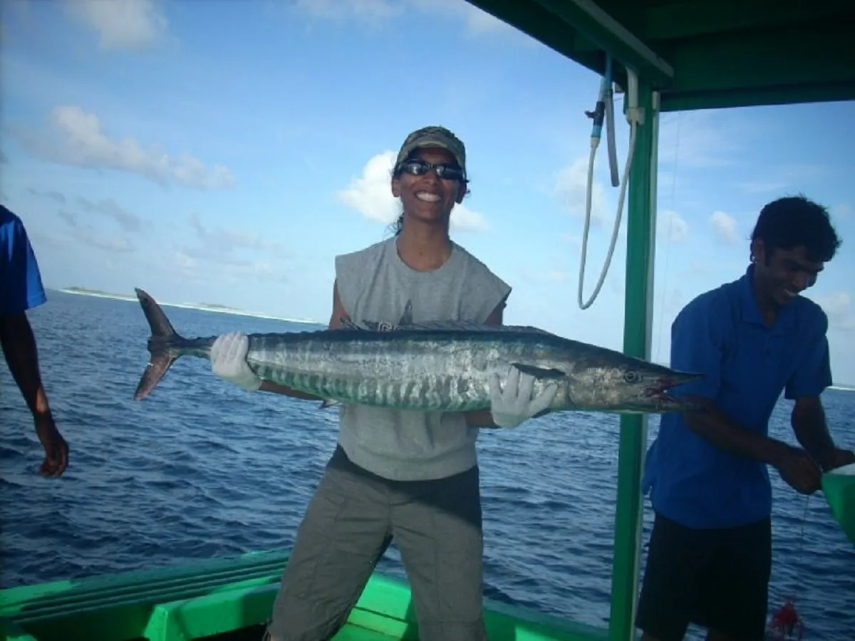 a female angler with a big wahoo caught in the maldives