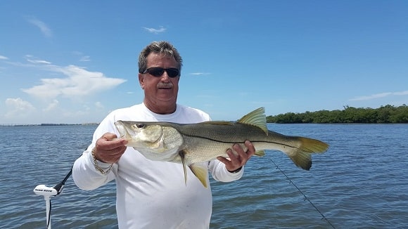 a fisherman fishing for big snook in southern Florida