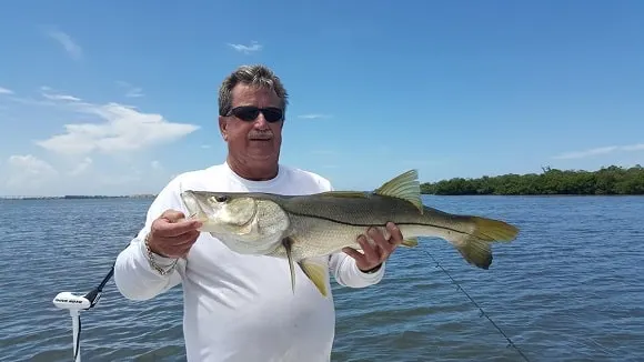a fisherman fishing for big snook in southern Florida