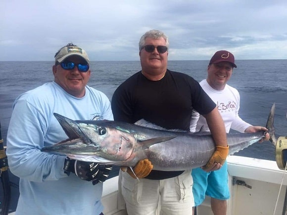 a group of saltwater anglers fishing for giant wahoo in the Florida Keys